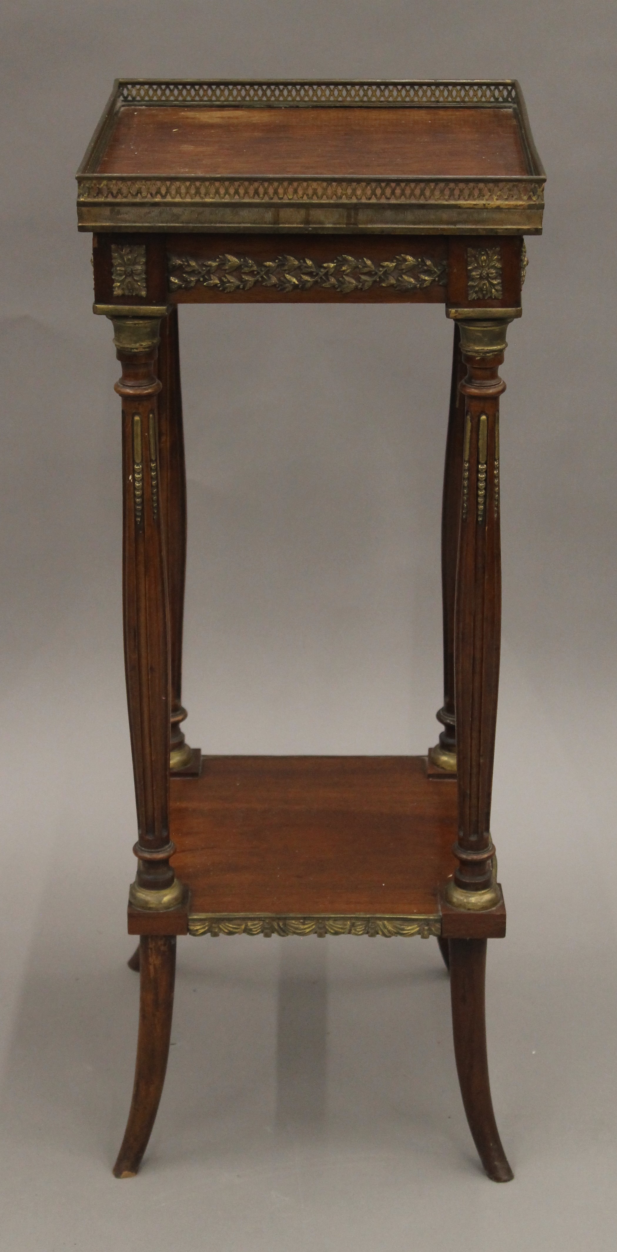 A French gilt metal mounted two-tier side table. 31.5 cm square.