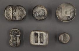 Six Chinese ingots.