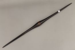 A Fijian or possibly Australian Aboriginal hardwood double point throwing club. 94.5 cm long.