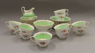 A florally decorated porcelain tea set.