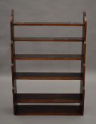 A Victorian mahogany waterfall bookcase. 81.5 cm wide.