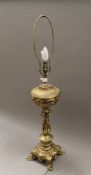 A brass table lamp. 90.5 cm high overall.