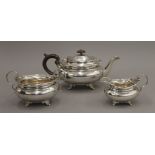 A silver three-piece tea set. The teapot 14.5 cm high. 43.6 troy ounces total weight.