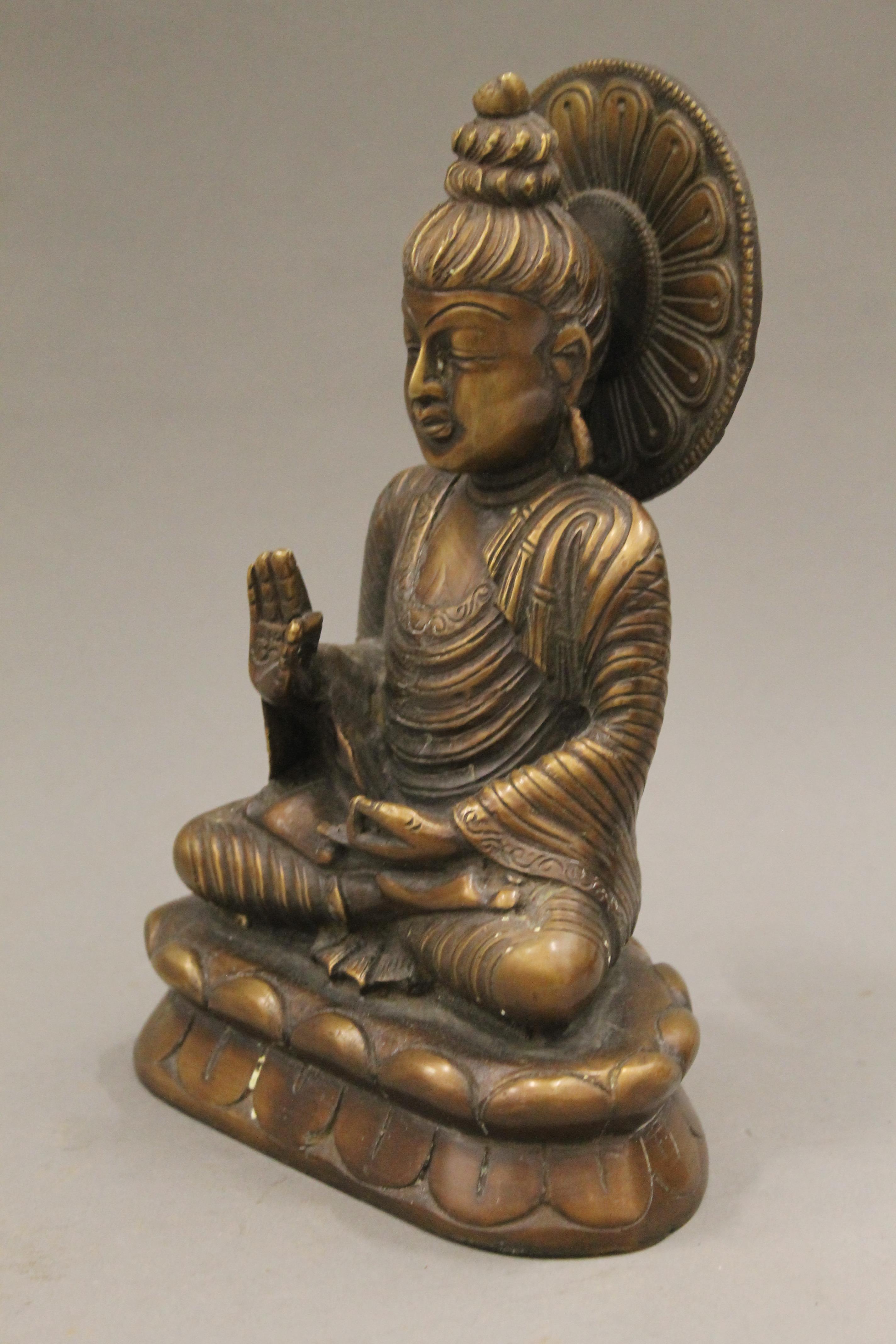 A bronze model of Buddha. 21 cm high. - Image 2 of 4