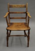 A 19th century elm open armchair. 52.5 cm wide.