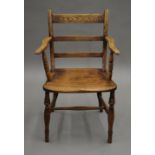 A 19th century elm open armchair. 52.5 cm wide.