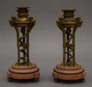 A pair of 19th century bronze and marble candlesticks. Each 18 cm high.