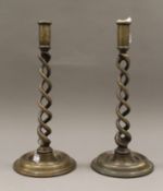 A pair of brass barley twist candlesticks. 32.5 cm high.