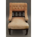 A Victorian walnut framed upholstered nursing chair. 54 cm wide.