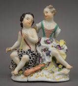 A 19th century Meissen porcelain figural group. 11.5 cm high.