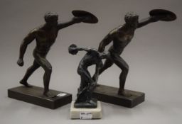 A pair of spelter models of gladiators, together with a small model Discus. The former each 22.