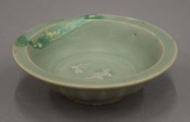 A Ming celadon ground fish bowl. 13 cm diameter.