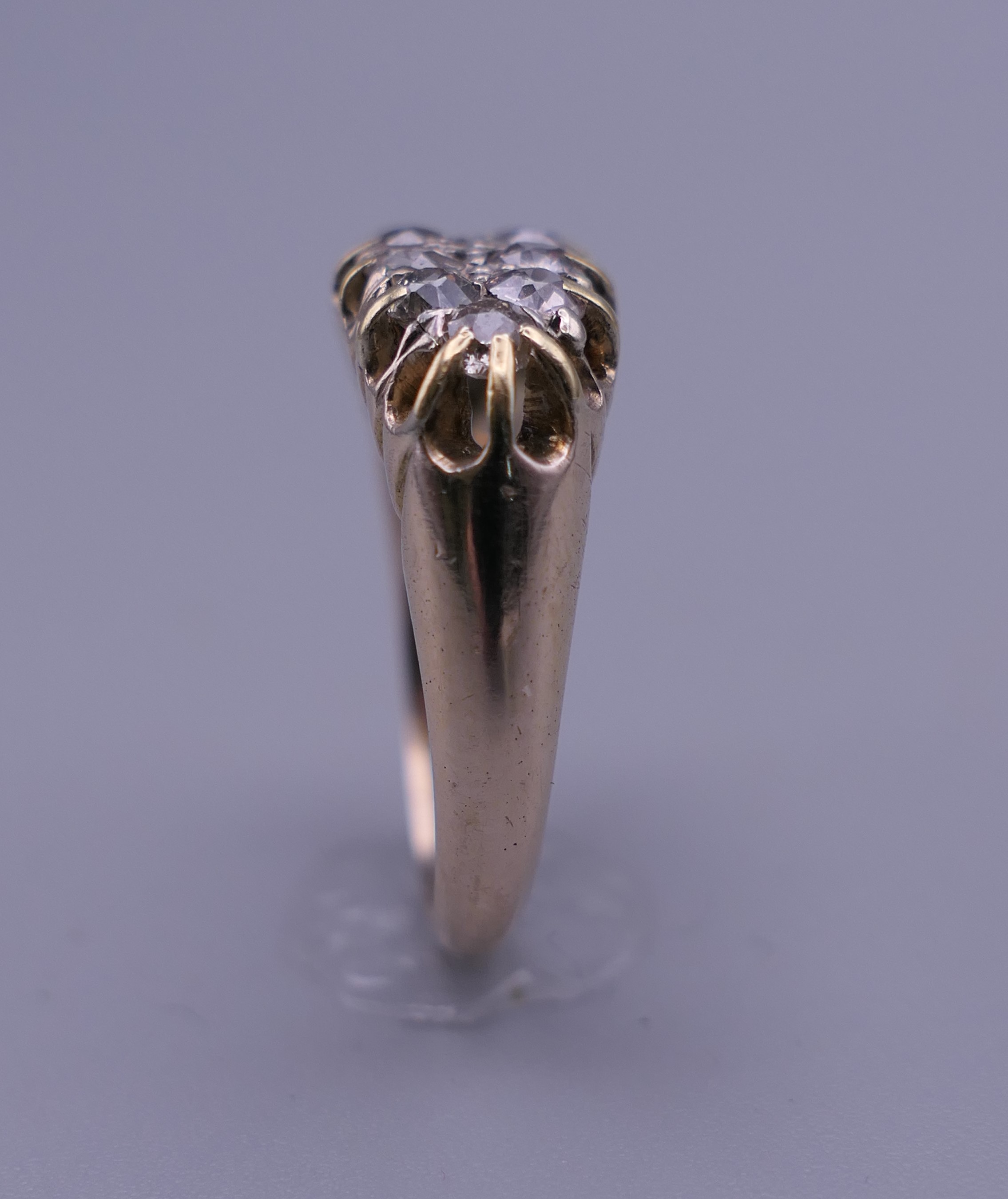 An 18 ct gold and diamond ring. Ring size O/P. 6 grammes total weight. - Image 7 of 9