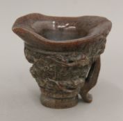 A libation cup. 12 cm high.