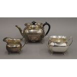 A silver three-piece tea set. The teapot 14 cm high. 18.9 troy ounces total weight.