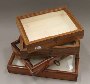 Four vintage display cases. The largest 33 x 22.5 cm.