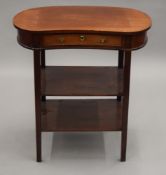 A Victorian mahogany kidney shaped single drawer side table. 68 cm wide.