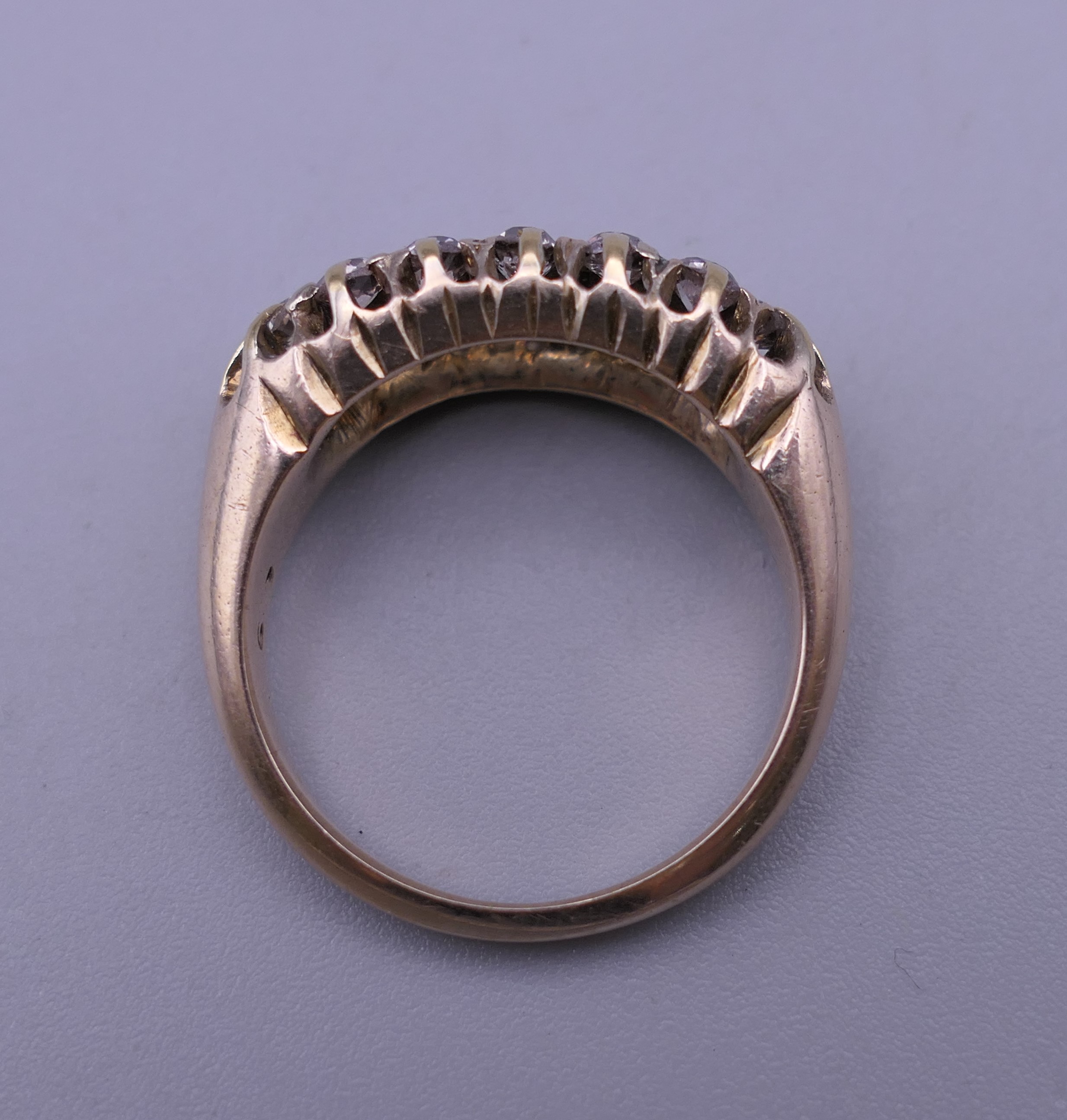 An 18 ct gold and diamond ring. Ring size O/P. 6 grammes total weight. - Image 3 of 9