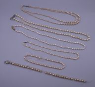 A quantity of pearl bead necklaces.