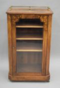 A Victorian inlaid walnut music cabinet. 54 cm wide.