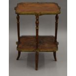 A Galle style two tier side table. 55.5 cm wide.