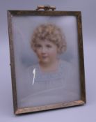 An early 20th century framed miniature portrait of a girl. 8.75 x 11 cm overall.