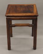 A Chinese hardwood side table. 40 cm squared.