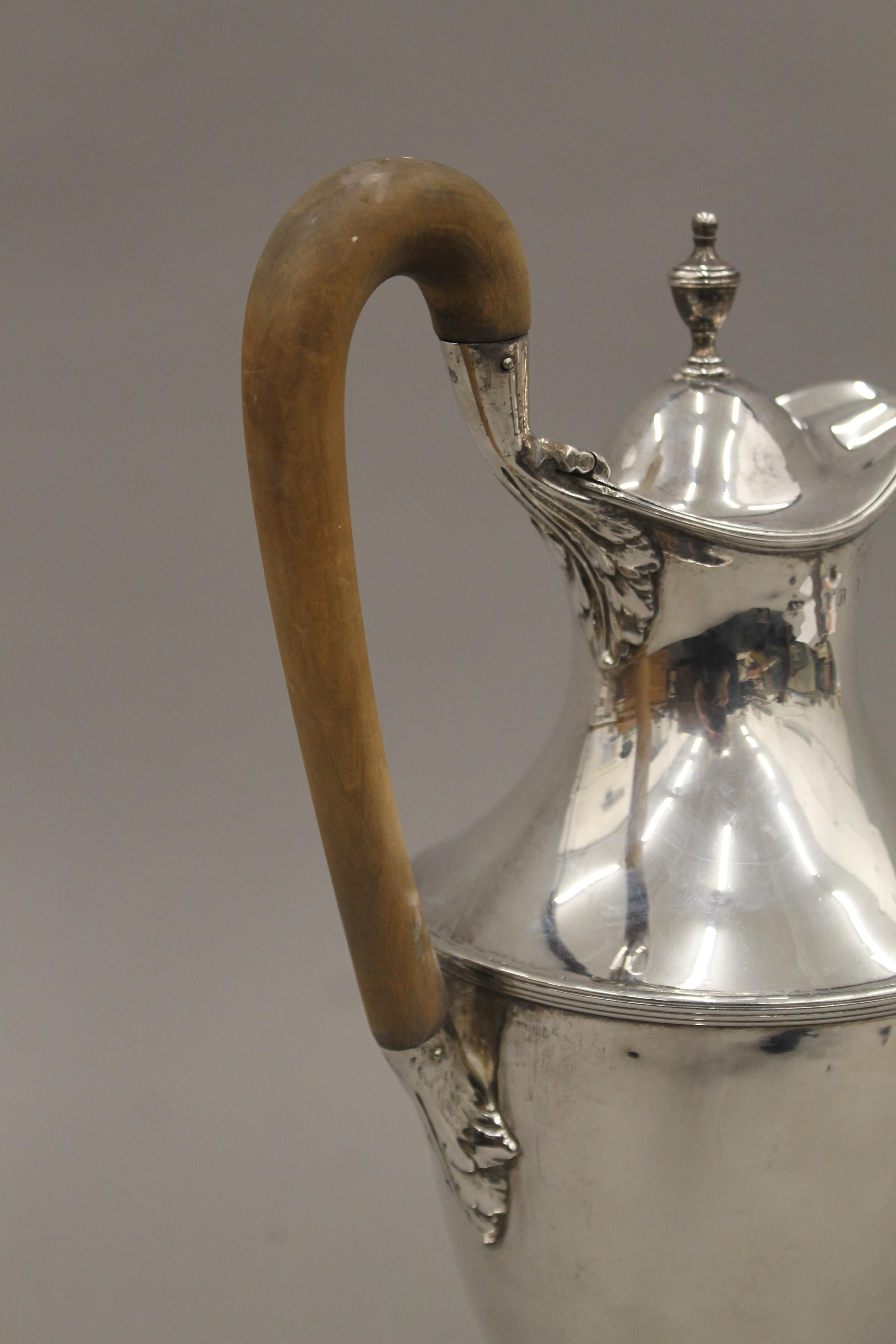 A Georgian silver hot water jug, makers mark of Hester Bateman. 31.5 cm high. 19. - Image 5 of 5