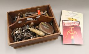 A collection of antique and vintage corkscrews.