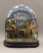 An antique automaton under dome with moving windmill, watermill steam train and rocking boat,