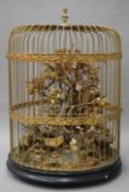 A Victorian taxidermy filled birdcage. 62 cm high.