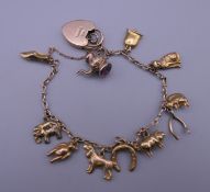 A 9 ct gold charm bracelet. 14.2 grammes.