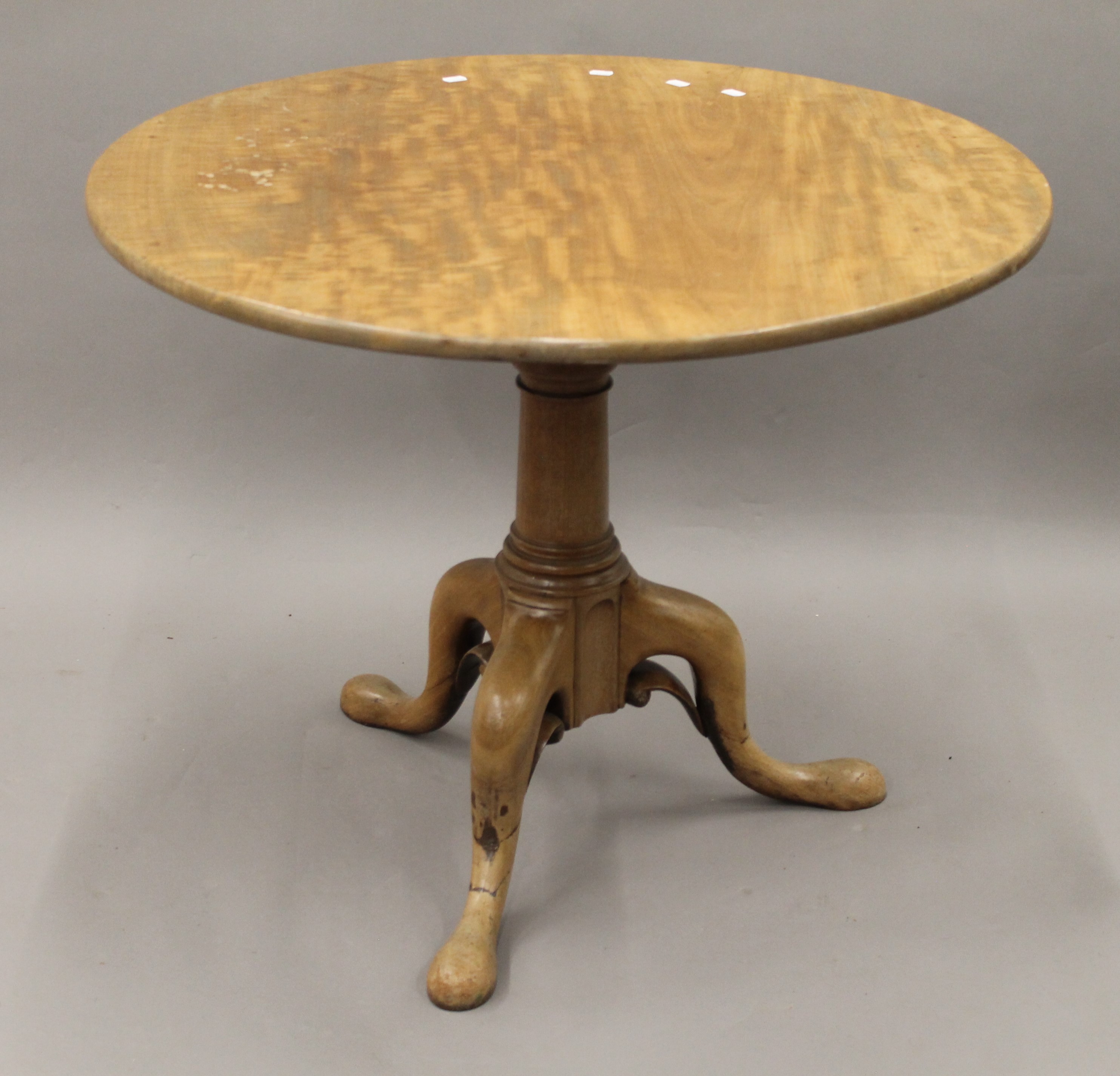 A George III mahogany birdcage tilt top tripod table. 92 cm diameter.