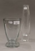 An Orrefors glass vase and another. The former 28.5 cm high.