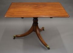 A 19th century mahogany tilt top breakfast table. The top 116 x 89 cm.