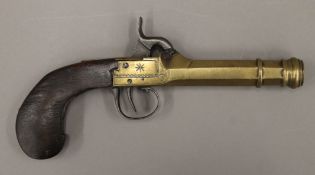 A 19th century brass barrelled percussion pocket pistol. 21 cm long.