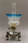 A Victorian Griffin oil lamp with original blue acid etched shade. 45 high overall.