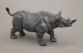 A cold painted bronze model of a rhino. 14 cm long.