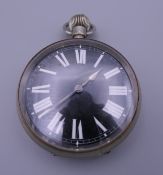 A black dialled Goliath pocket watch, movement marked May 1886, in box. 6.5 cm diameter.