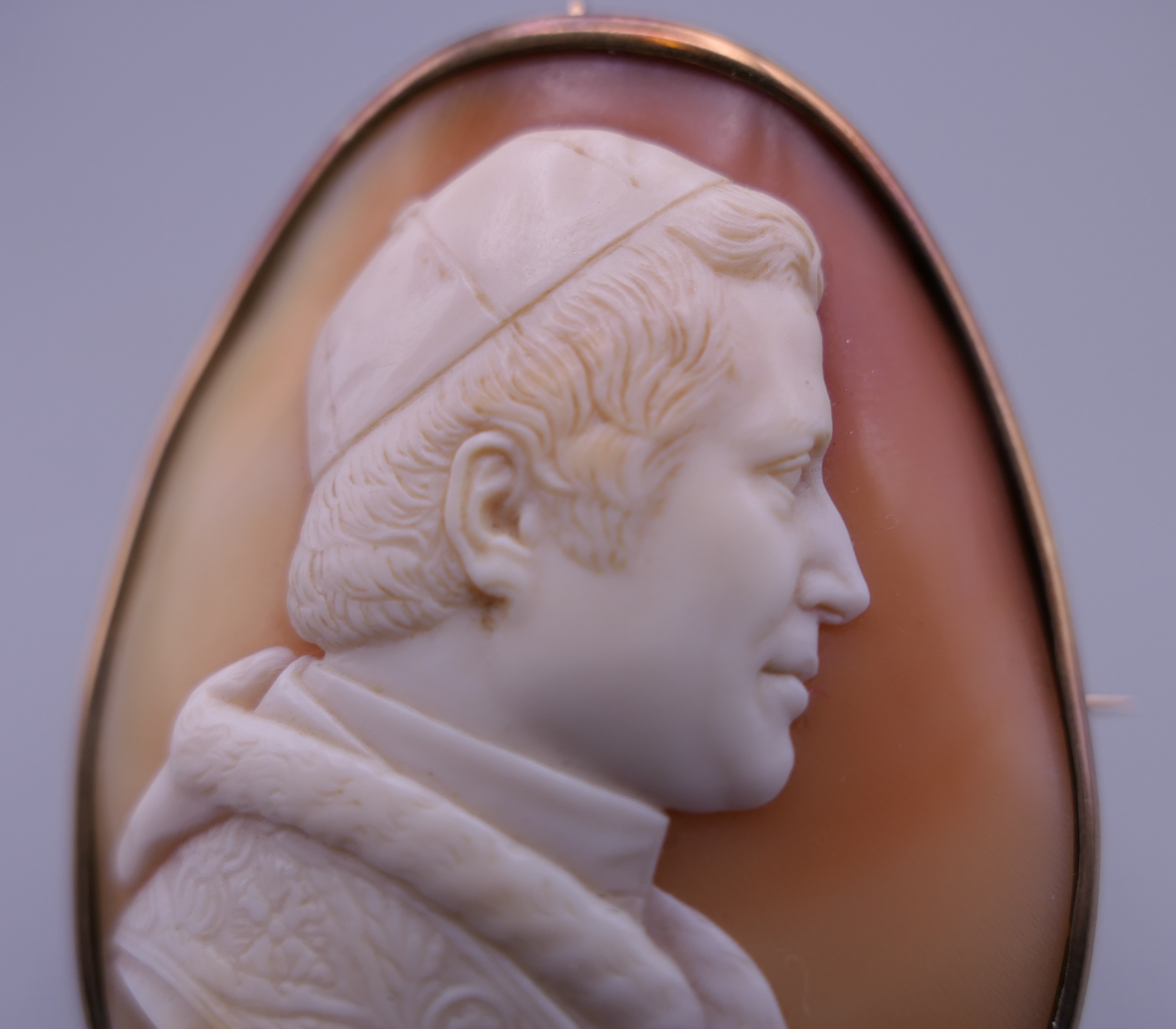A 19th century unmarked gold framed cameo brooch carved as Pope Pius IX, signed Finet. 5.5 cm high. - Image 2 of 7