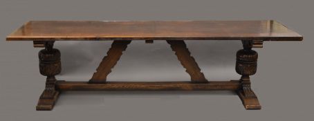 A large carved oak refectory table. 272 cm long x 76.5 cm wide.