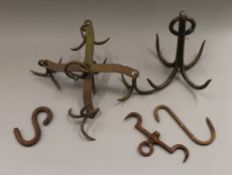 A quantity of antique game hangers, etc.