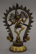 An Indian cast bronze figure of a deity. 22.5 cm high.