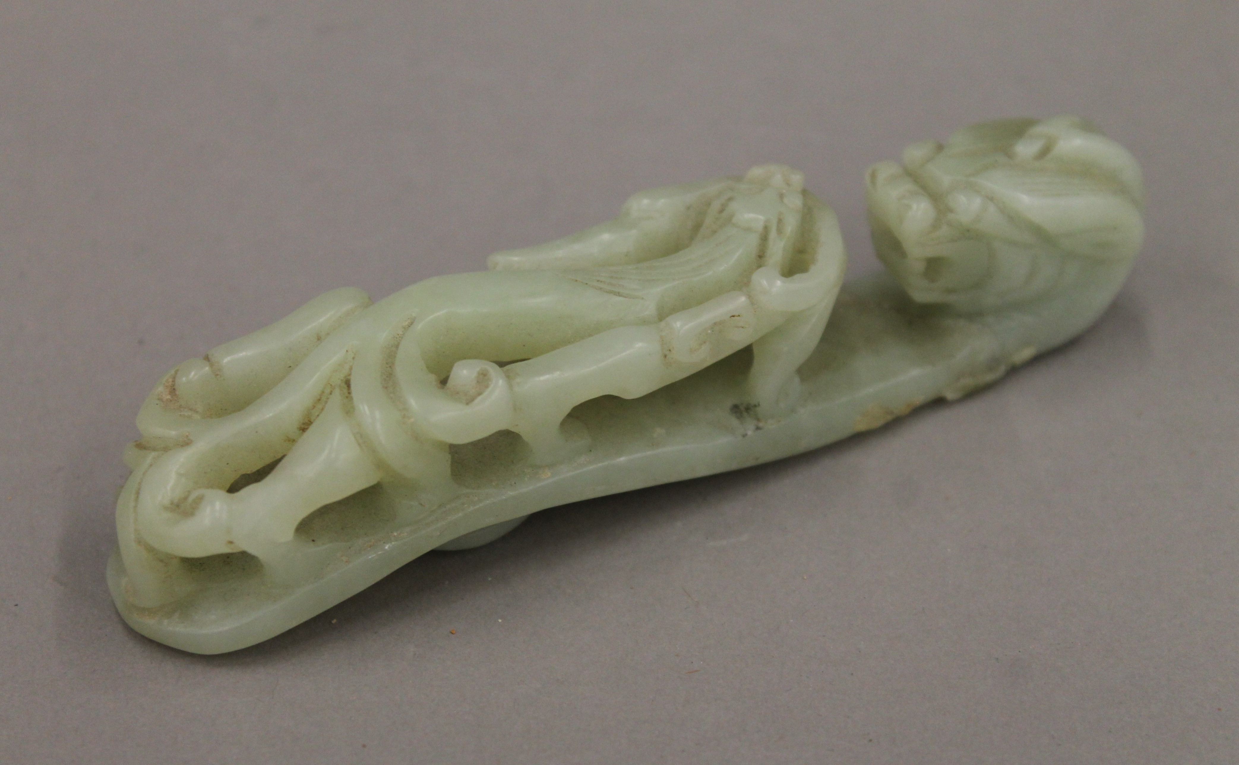 A Chinese jade belt hook. 12.5 cm long.