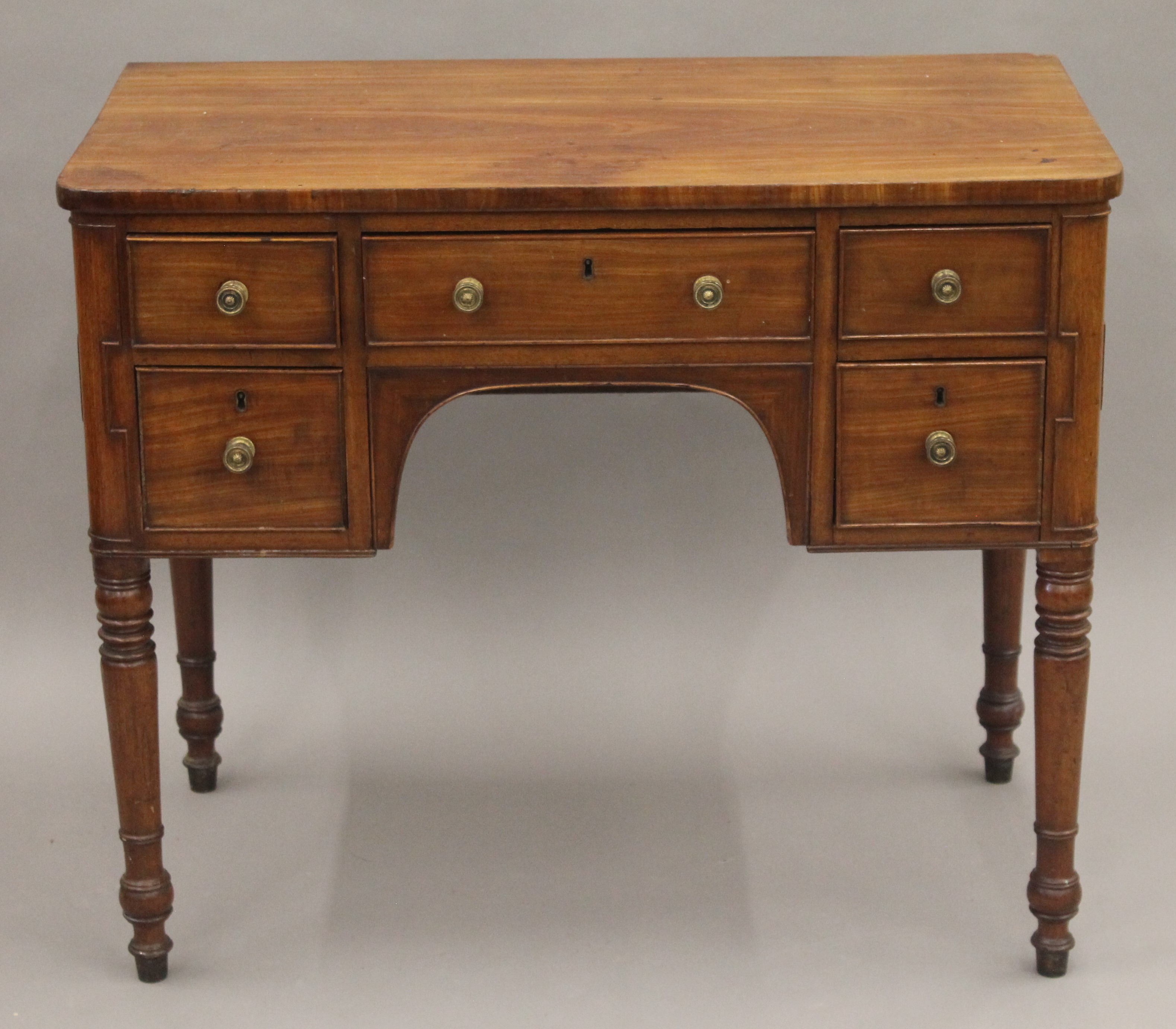 A 19th century mahogany knee hole dressing table. 90 cm wide.