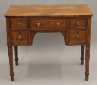 A 19th century mahogany knee hole dressing table. 90 cm wide.