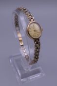 A Marvin 9 ct gold ladies wristwatch. 13.7 grammes total weight.