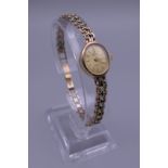 A Marvin 9 ct gold ladies wristwatch. 13.7 grammes total weight.