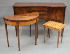 A 19th century demi-lune tea table, a sideboard and a chess table.