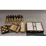 A quantity of chess sets, dominoes, etc.